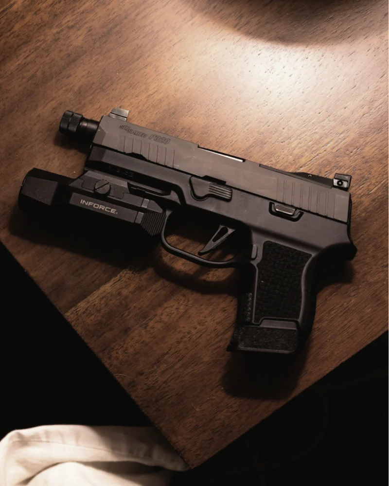 Compact handgun on a wooden table